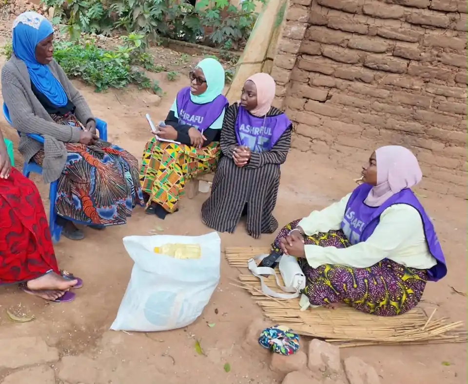 Ashraful Aid Malawi volunteers with elderly women during the Forgotten Mothers Project