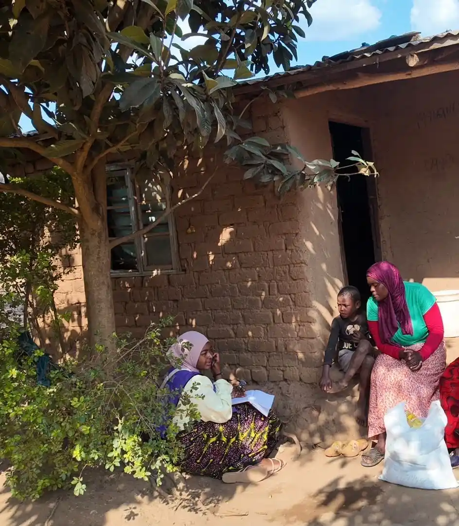 Ashraful Aid Malawi volunteers with elderly women during the Forgotten Mothers Project